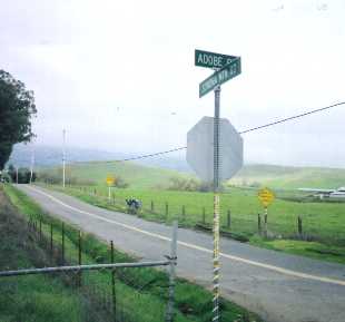 Signs at the base of Sonoma Mountain Road