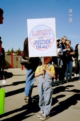 Child with sign, Lafferty and Justice for All!